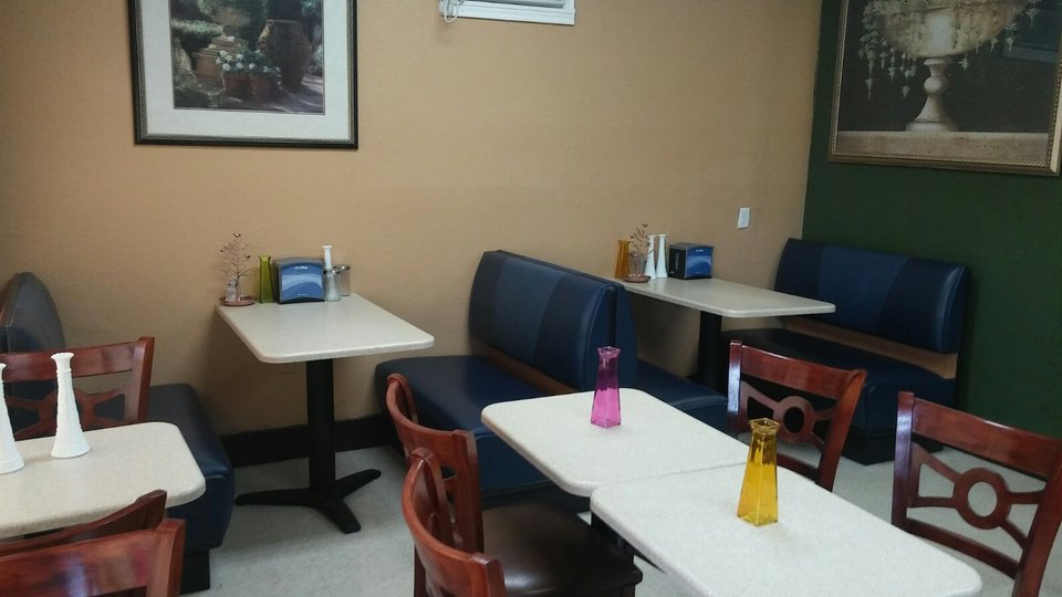 Warm restaurant interior with Haitian cuisine