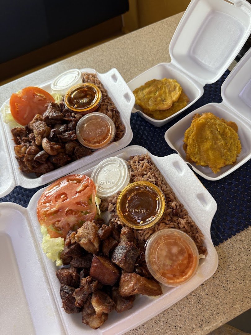 Haitian dishes plated in a restaurant dining room